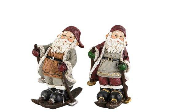 2 olika tomtar på skidor